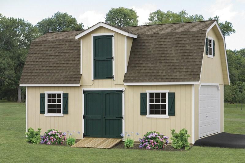 Two-Story Dutch Barn with cream siding, brown roofing, white trim, green shutters, a white garage door, and green entrance doors.