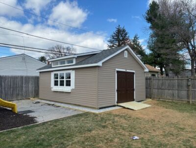 16x20 Vinyl Classic Cottage with a Studio Dormer, and a stone gravel pad