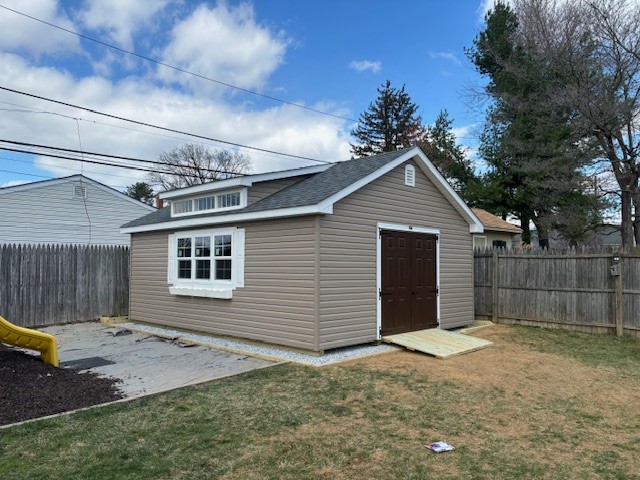 16x20 Vinyl Classic Cottage with a Studio Dormer, and a stone gravel pad