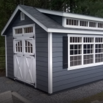 blue shed with white doors, windows, and trim